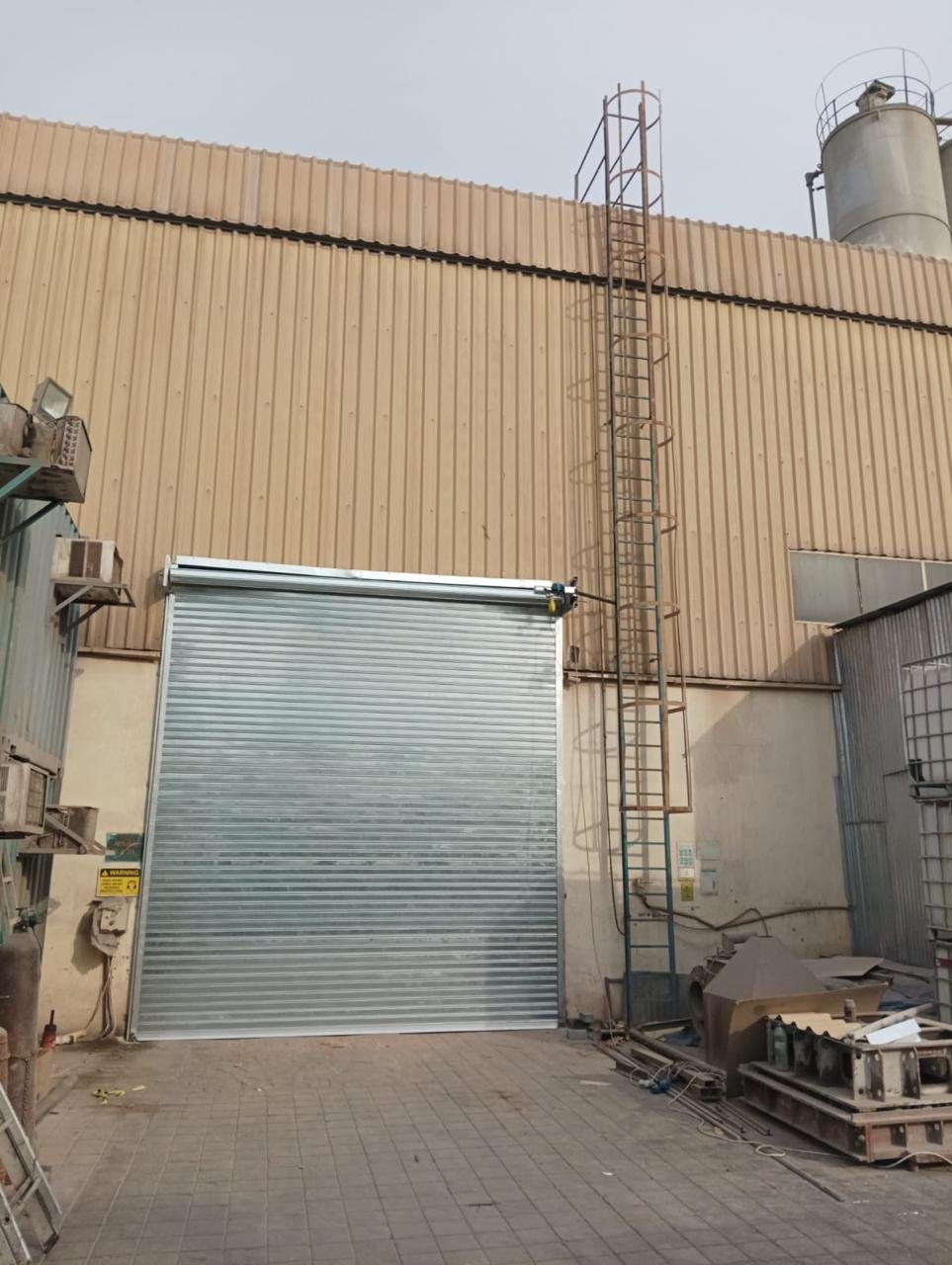 Galvanized GI rolling shutter on an industrial building