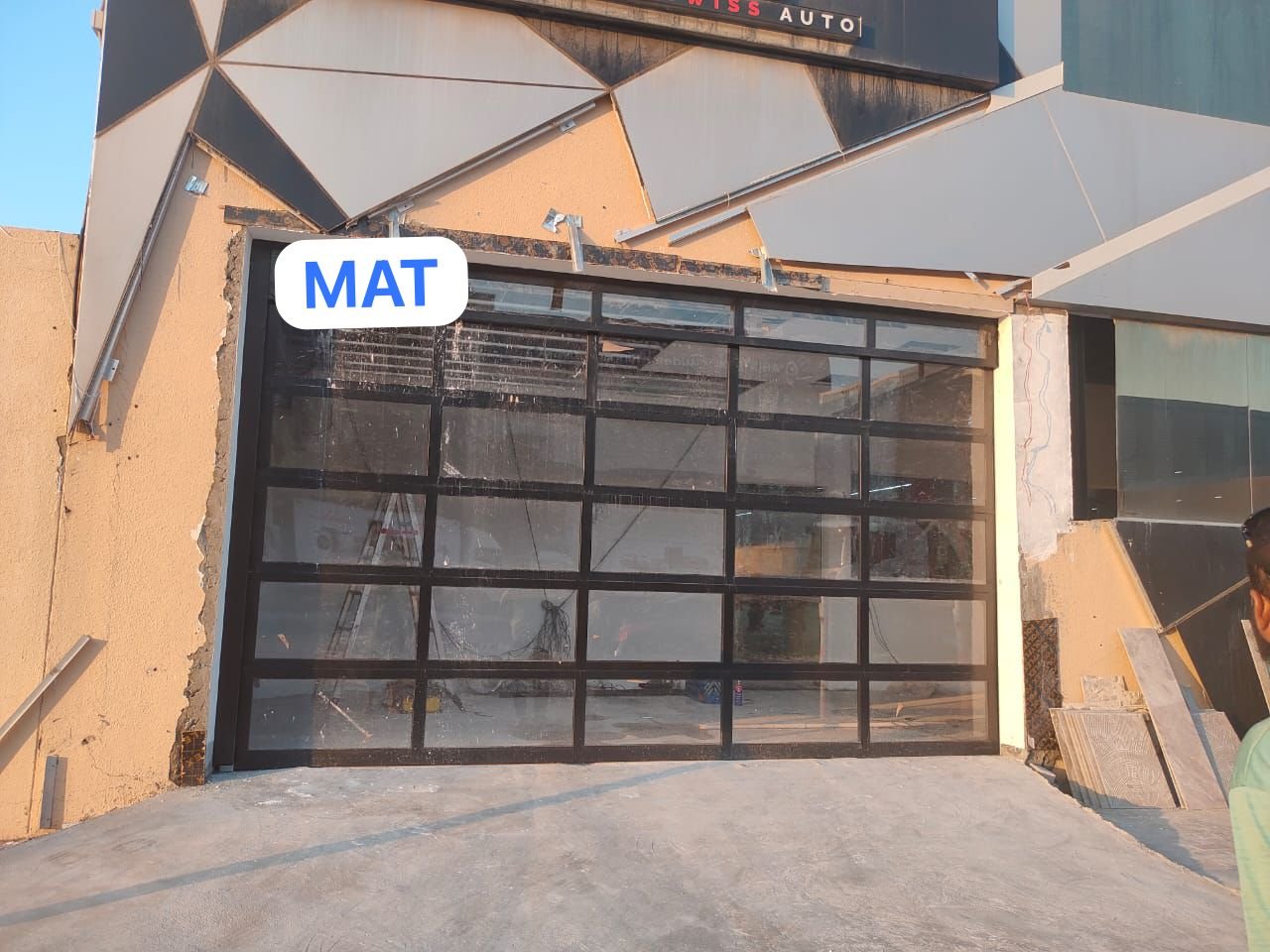 Glass and aluminium garage door with black frame