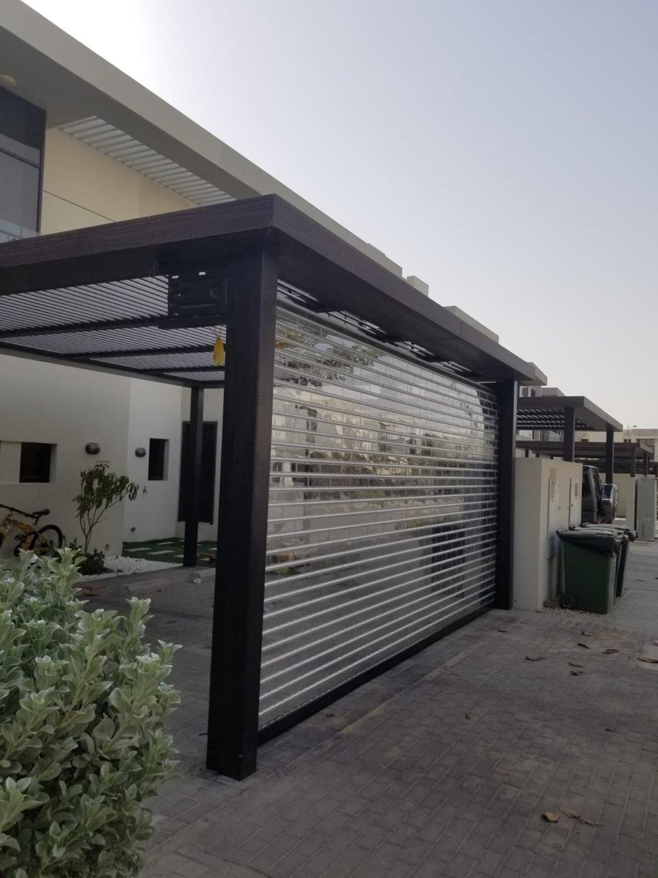 Polycarbonate roller shutter on a carport